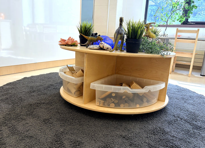 A Fern Kids short circular mobile storage table set up as a small-world play scene