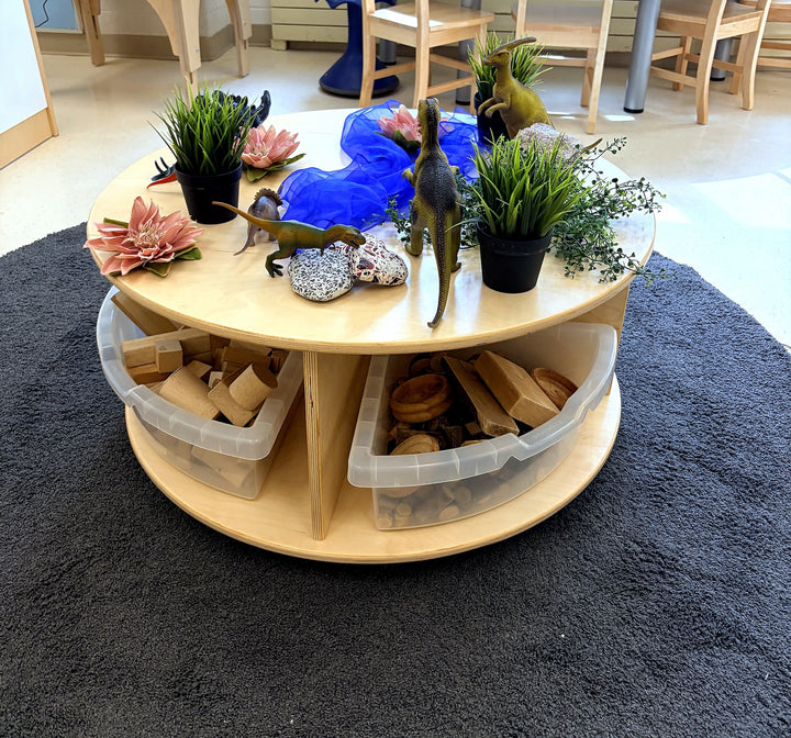 Close-up of a Fern Kids circular mobile storage table with open storage beneath
